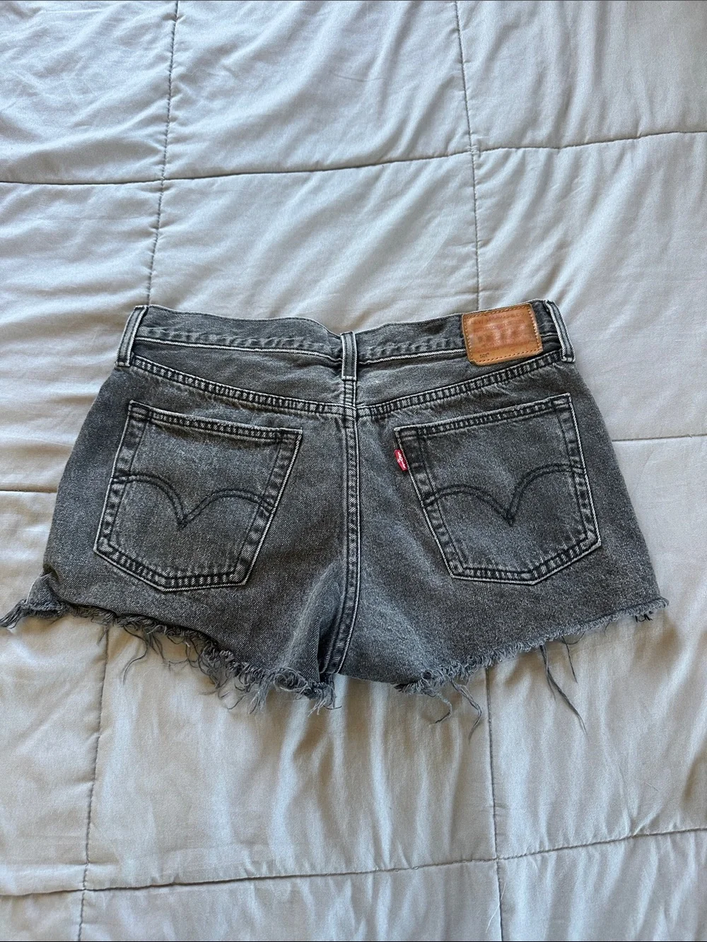 Levi’s Black Distressed Denim Cutoff Shorts